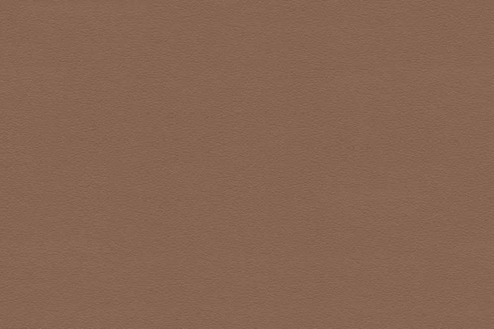 Close up of smooth brown leather texture with fine grain pattern on solid background
